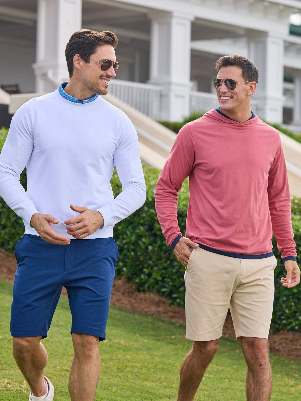 Two golfers walking past the clubhouse in NIAM layers