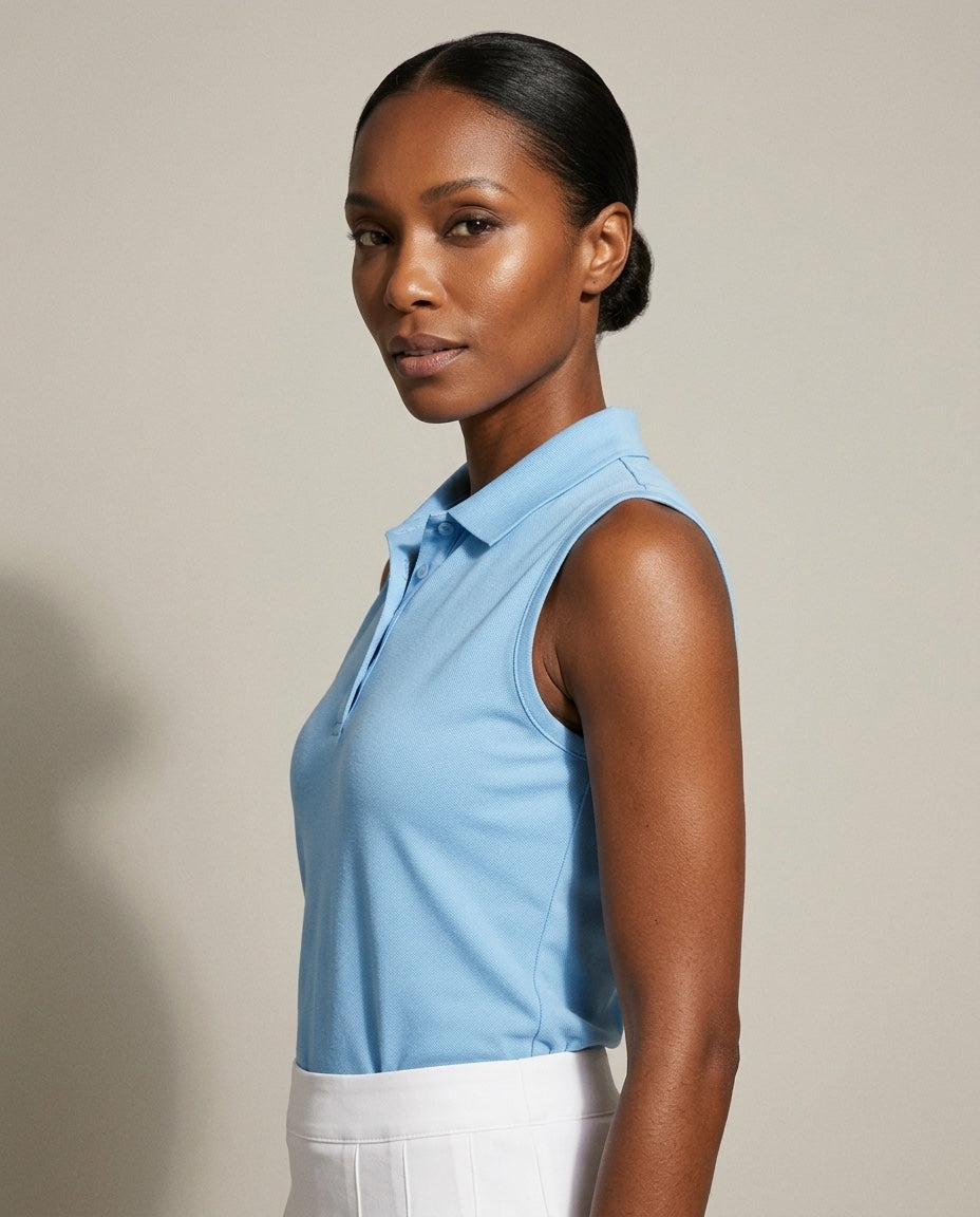 Women's 4 Button Sleeveless Pique Polo in Light Blue, studio three-quarter view