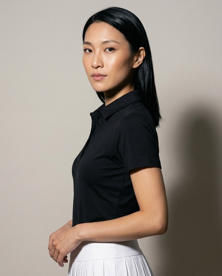 Women's SwingFree™ Performance Polo in Black, studio three-quarter view