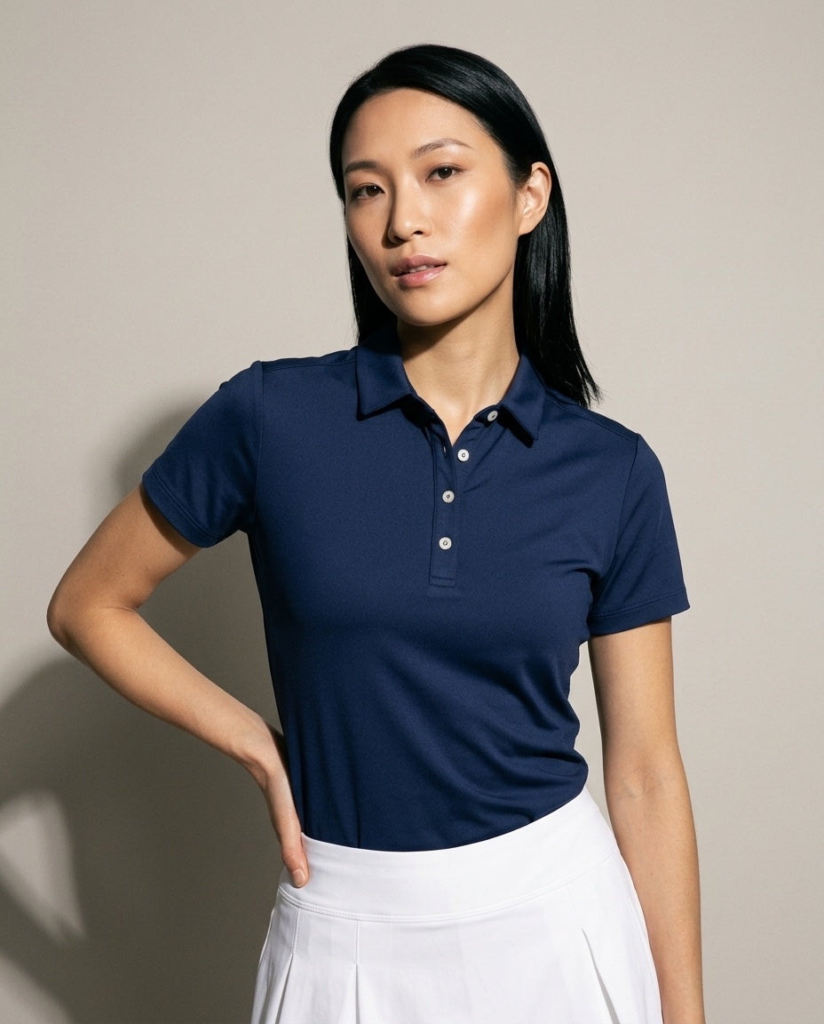 Women's SwingFree™ Performance Polo in Navy, studio front view