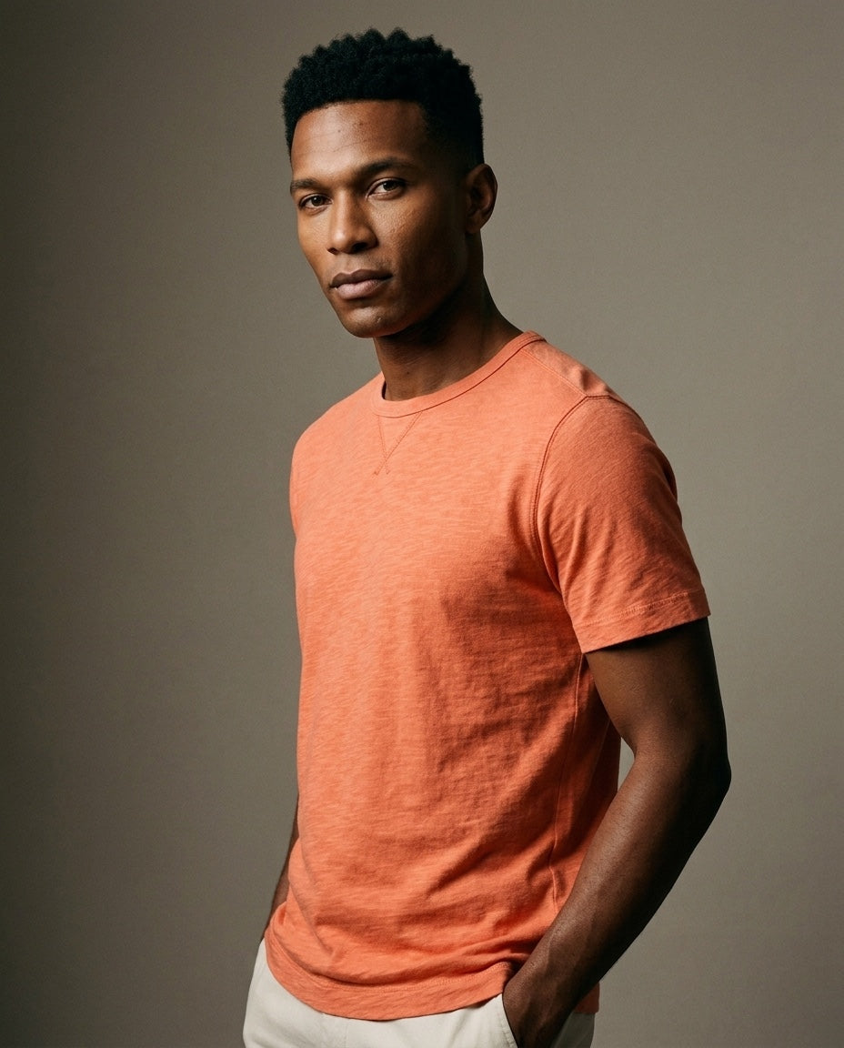 Men's Short Sleeve Tee in Coral, studio three-quarter view