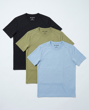 Three short-sleeve crew-neck t-shirts by NIAM in black, olive green, and light blue, arranged in a stacked fan layout on a light gray background.
