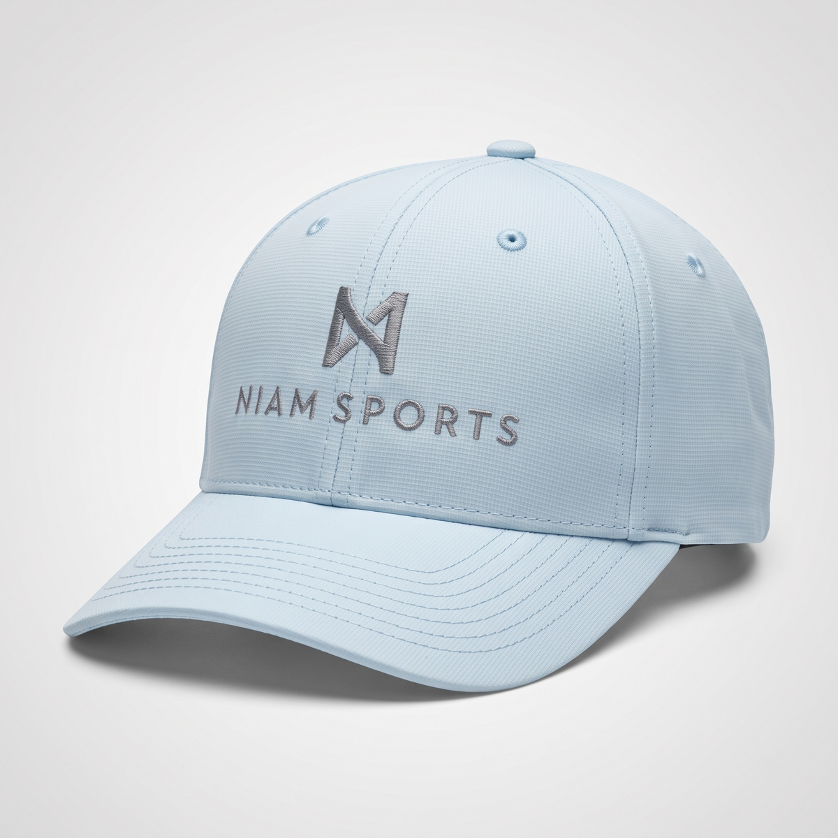 NIAM Sports Performance Golf Cap in Soft Blue, structured five-panel crown with pre-curved visor and tonal gray embroidered logo
