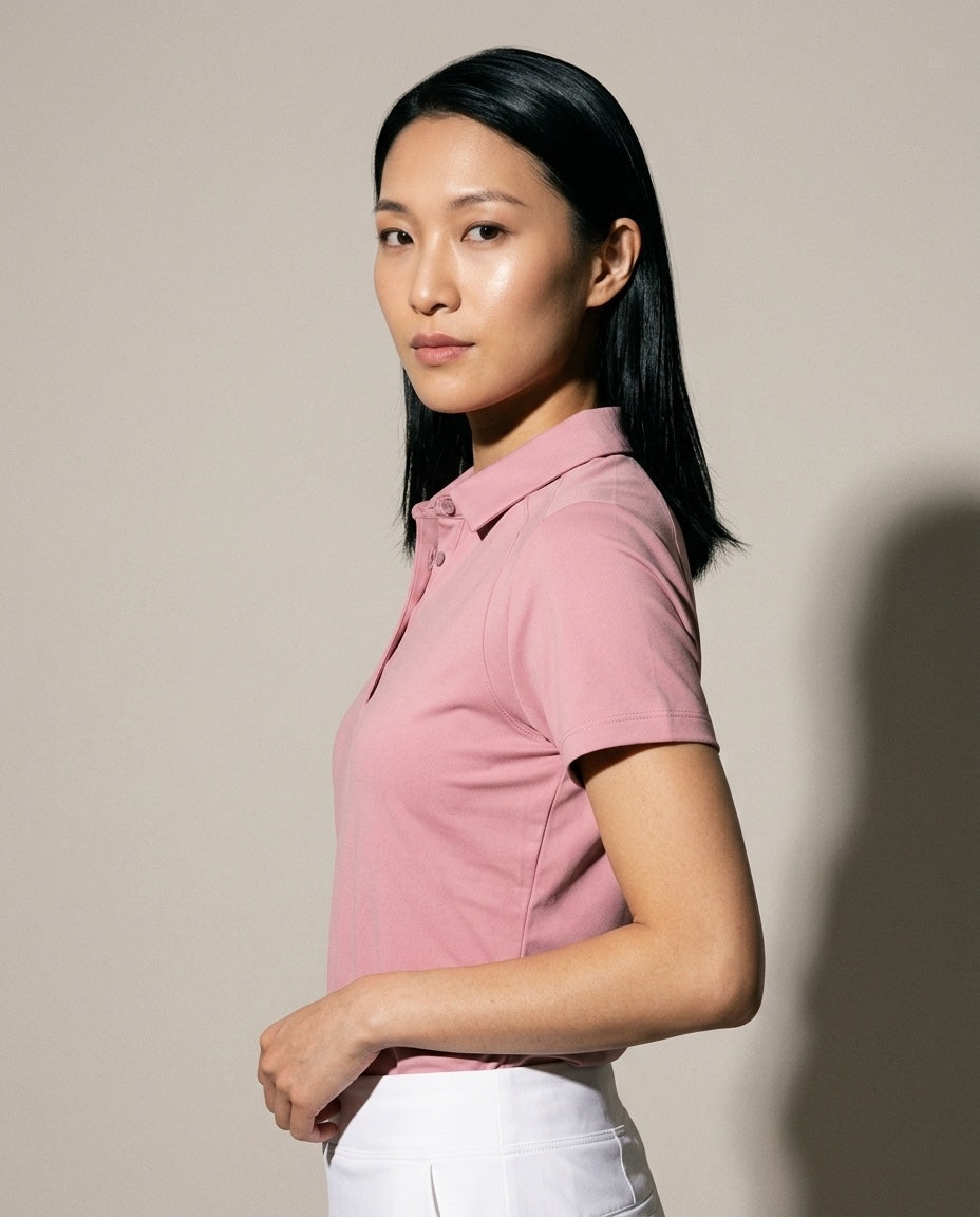 Women's SwingFree™ Performance Polo in Light Pink, studio three-quarter view