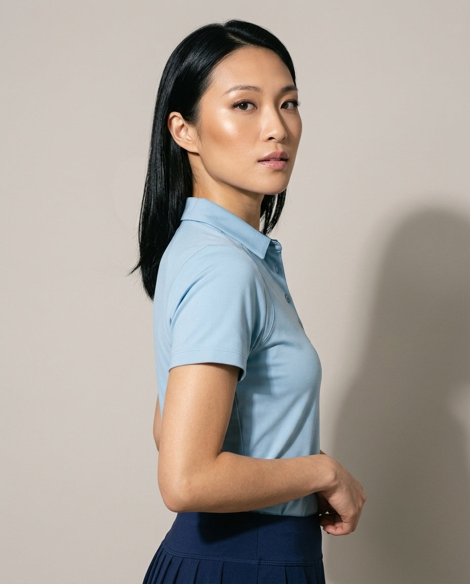 Women's SwingFree™ Performance Polo in Sky Blue, studio three-quarter view