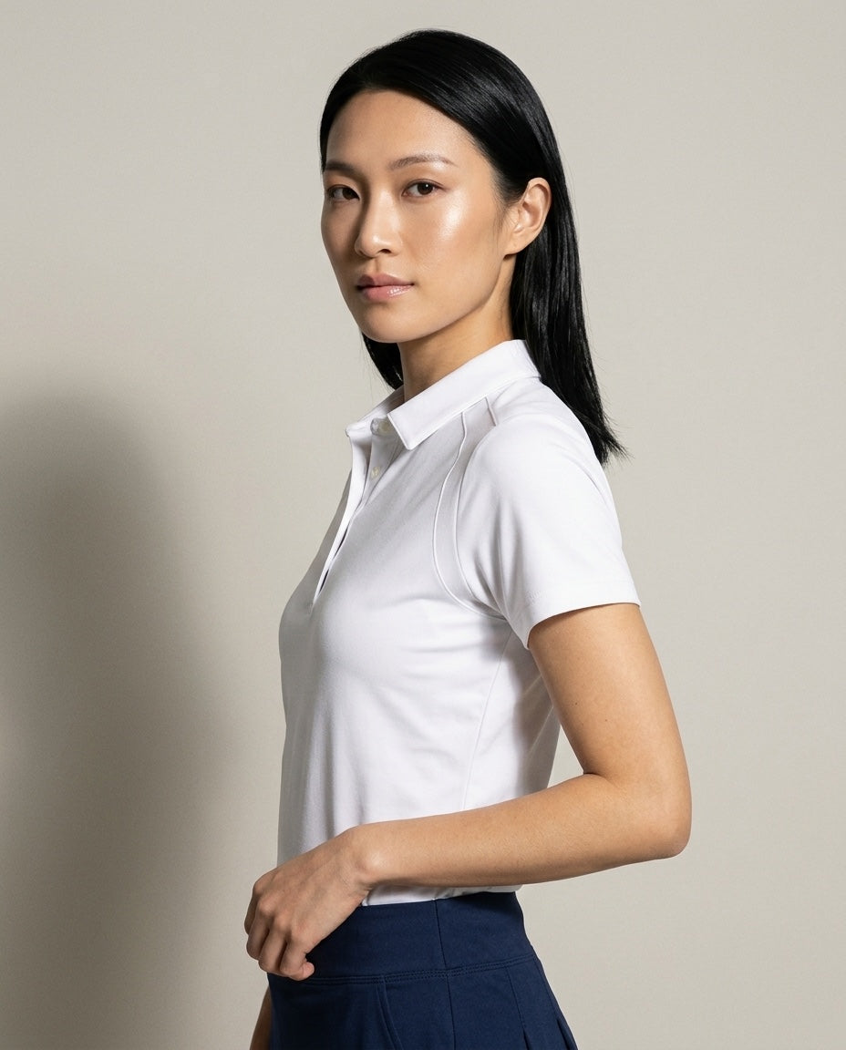 Women's SwingFree™ Performance Polo in White, studio three-quarter view